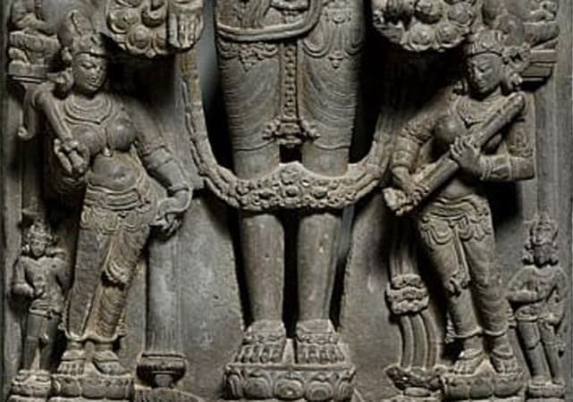 Vishnu with Lakshmi Saraswati and small figures of Shankha and Chakra SculpturePedia Vishnu with Lakshmi Saraswati and small figures of Shankha and Chakra